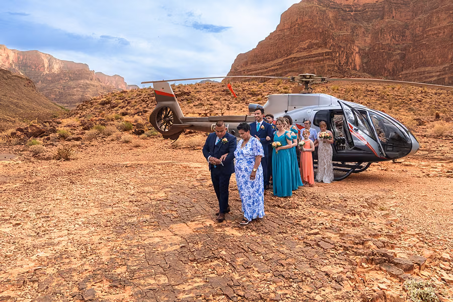 Wedding party lined up at the Grand Canyon for a Las Vegas helicopter wedding