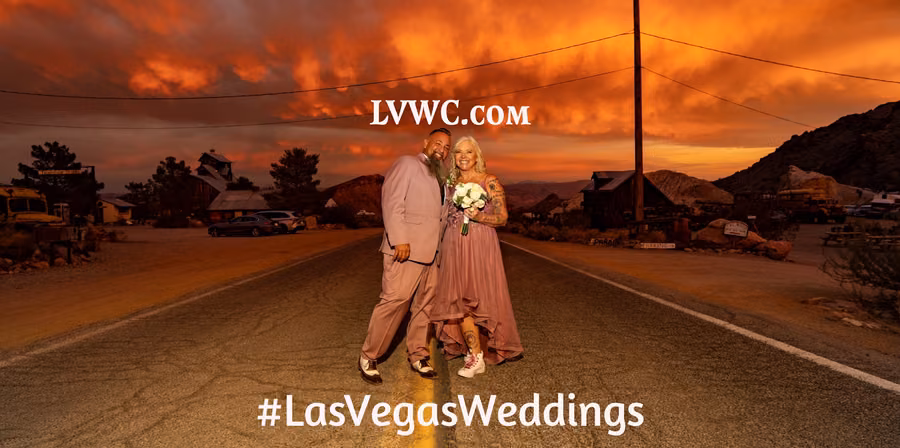 Wedding couple on the road through Nelson Ghost Town under a dramatic sunset sky
