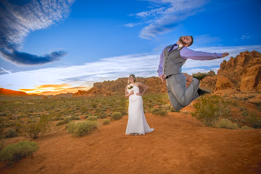 Bride and groom with desert bighorn sheep among the red rocks at Valley of Fire State Park