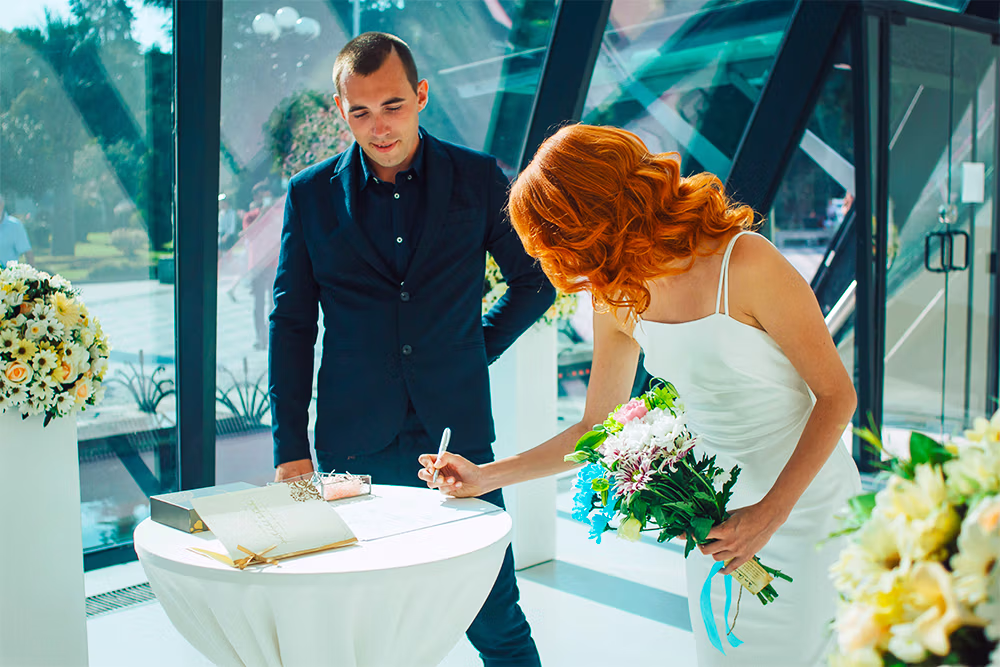 Nevada marriage certificate being finalized during a Las Vegas hotel room Sign & Go wedding
