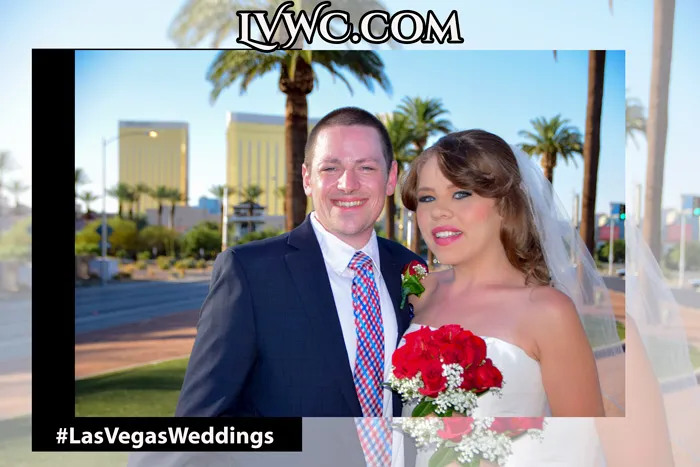 Newly married couple celebrating by the Las Vegas Welcome Sign.