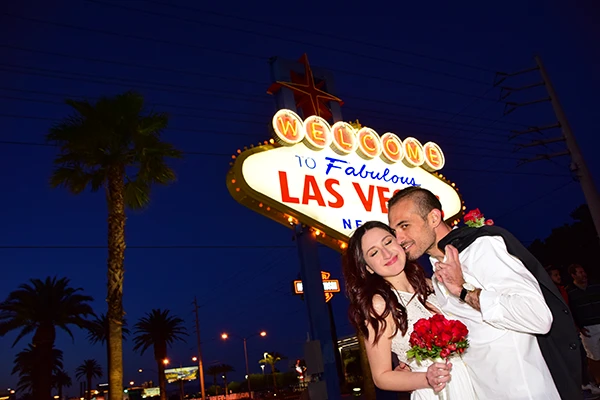 Bride and Groom exchange vows under the iconic Las Vegas Welcome Sign.